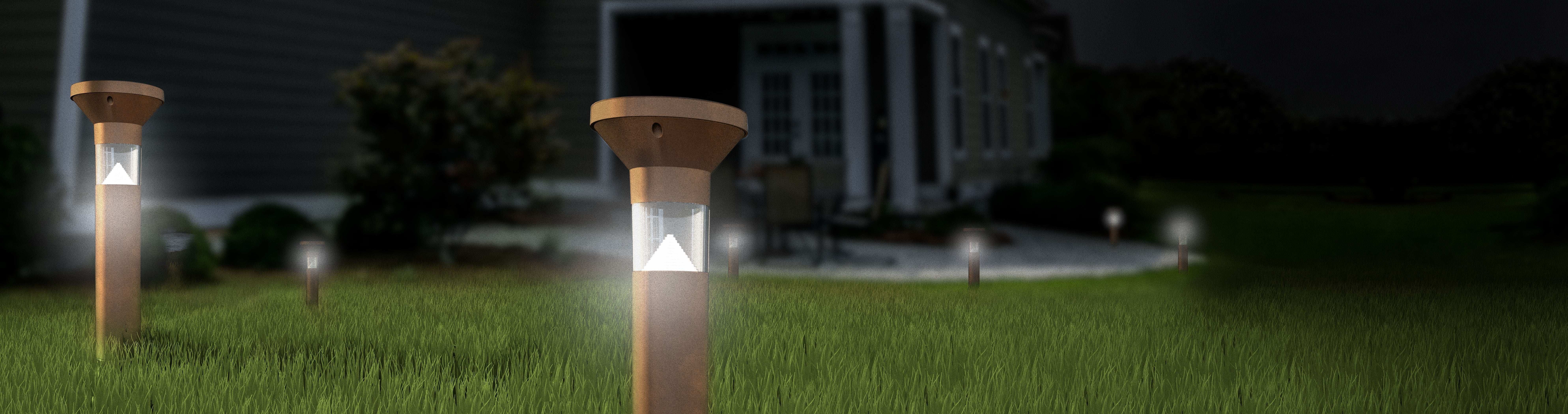 Feit Electric Onesync landscape bollard light in yard at night