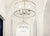 Hanging light fixture with while filament bulbs in hallway