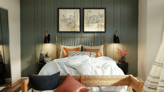 Straight shot of a bohemian bedroom with bed, wall art, and two wall sconces on either side of the bed.