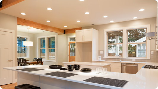Large kitchen with LED recessed downlights installed in ceiling.