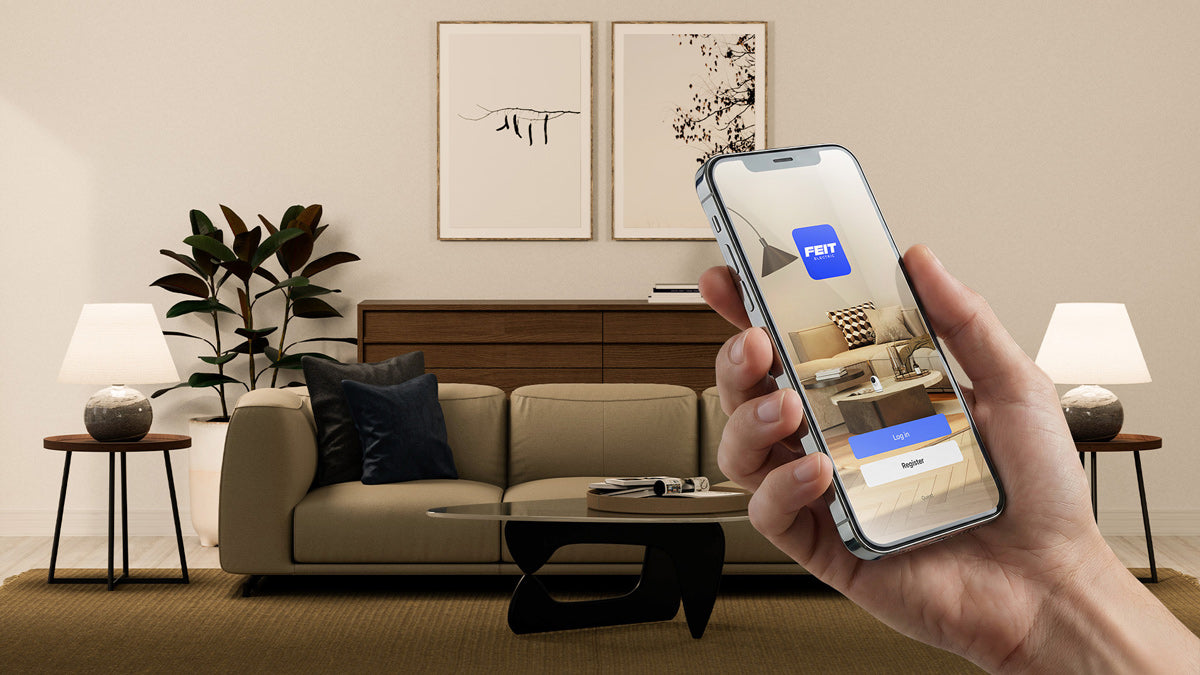 Hand holding a smartphone with an app interface over a living room setup