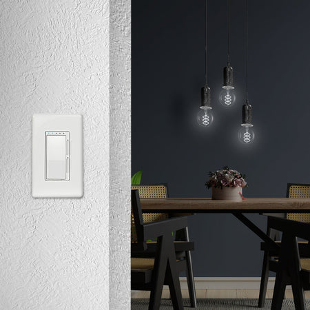 Light switch panel on a white wall with a dining area in the background