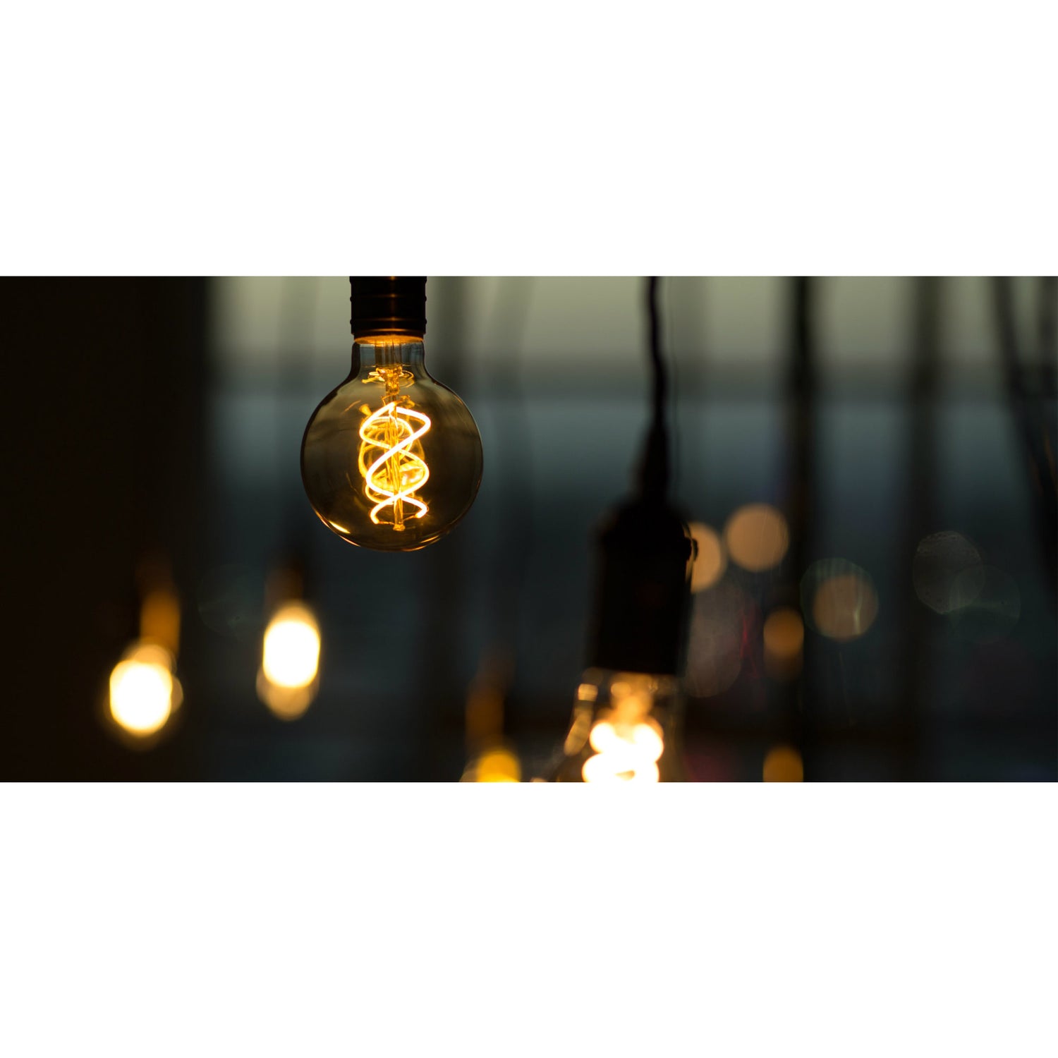 6.5W (60W Replacement) G63 E26 Dimmable Spiral Filament Amber Glass Vintage Edison LED Light Bulb, Warm White